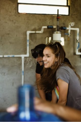 Man and woman standing indoors